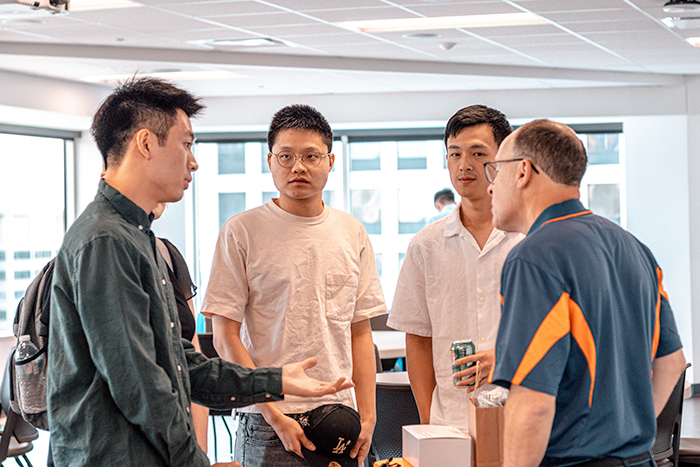 Sean Chang (left) speaks with Steve Miller, a UIUC alum and iVenture donor